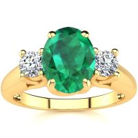 1 1/3 Carat Oval Shape Emerald and Two Diamond Ring In 14 Karat Yellow Gold