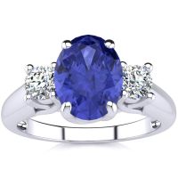 1 1/2 Carat Oval Shape Tanzanite and Two Diamond Ring In 14 Karat White Gold