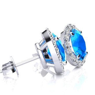 1 1/4 Carat Oval Shape Blue Topaz and Halo Diamond Stud Earrings In 14 Karat White Gold