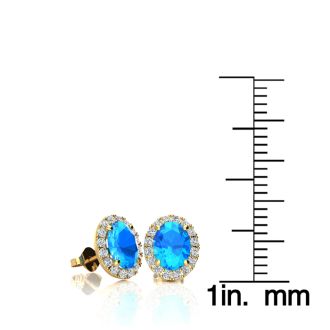 1 1/4 Carat Oval Shape Blue Topaz and Halo Diamond Stud Earrings In 14 Karat Yellow Gold