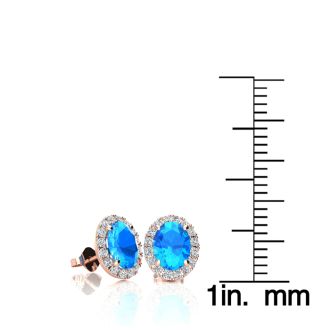 1 1/4 Carat Oval Shape Blue Topaz and Halo Diamond Stud Earrings In 14 Karat Rose Gold