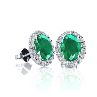 1 Carat Oval Shape Emerald and Halo Diamond Stud Earrings In 14 Karat White Gold