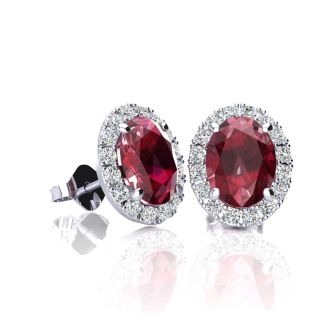 1 1/4 Carat Oval Shape Ruby and Halo Diamond Stud Earrings In 14 Karat White Gold