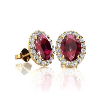 1 1/4 Carat Oval Shape Ruby and Halo Diamond Stud Earrings In 14 Karat Yellow Gold