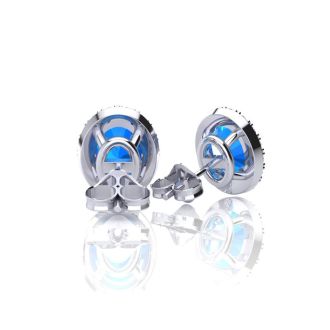 2 1/4 Carat Oval Shape Blue Topaz and Halo Diamond Stud Earrings In 14 Karat White Gold