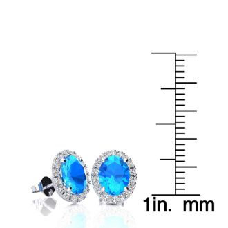 2 1/4 Carat Oval Shape Blue Topaz and Halo Diamond Stud Earrings In 14 Karat White Gold