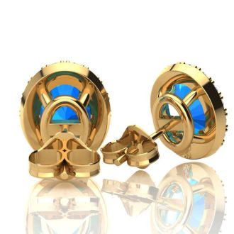 2 1/4 Carat Oval Shape Blue Topaz and Halo Diamond Stud Earrings In 14 Karat Yellow Gold