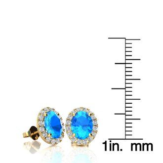 2 1/4 Carat Oval Shape Blue Topaz and Halo Diamond Stud Earrings In 14 Karat Yellow Gold