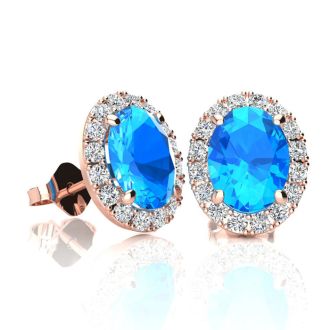 2 1/4 Carat Oval Shape Blue Topaz and Halo Diamond Stud Earrings In 14 Karat Rose Gold