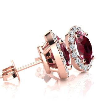2 Carat Oval Shape Ruby and Halo Diamond Stud Earrings In 14 Karat Rose Gold