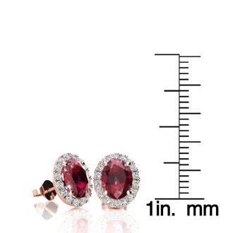 2 Carat Oval Shape Ruby and Halo Diamond Stud Earrings In 14 Karat Rose Gold