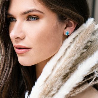 3 1/4 Carat Oval Shape Blue Topaz and Halo Diamond Stud Earrings In 14 Karat White Gold