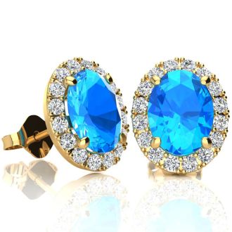 3 1/4 Carat Oval Shape Blue Topaz and Halo Diamond Stud Earrings In 14 Karat Yellow Gold