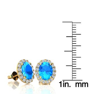 3 1/4 Carat Oval Shape Blue Topaz and Halo Diamond Stud Earrings In 14 Karat Yellow Gold