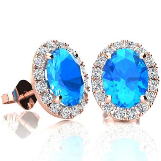 3 1/4 Carat Oval Shape Blue Topaz and Halo Diamond Stud Earrings In 14 Karat Rose Gold