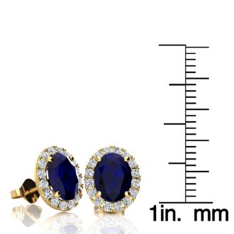 3 1/2 Carat Oval Shape Sapphire and Halo Diamond Stud Earrings In 14 Karat Yellow Gold