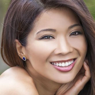 3 1/2 Carat Oval Shape Sapphire and Halo Diamond Stud Earrings In 14 Karat Yellow Gold