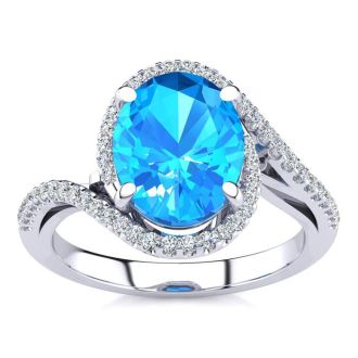 3 1/2 Carat Oval Shape Blue Topaz and Halo Diamond Ring In 14 Karat White Gold