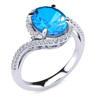 3 1/2 Carat Oval Shape Blue Topaz and Halo Diamond Ring In 14 Karat White Gold