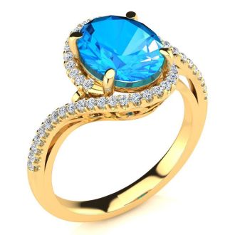 3 1/2 Carat Oval Shape Blue Topaz and Halo Diamond Ring In 14 Karat Yellow Gold