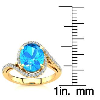 3 1/2 Carat Oval Shape Blue Topaz and Halo Diamond Ring In 14 Karat Yellow Gold