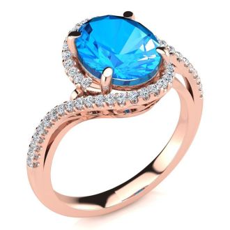 3 1/2 Carat Oval Shape Blue Topaz and Halo Diamond Ring In 14 Karat Rose Gold