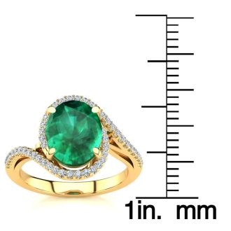 2 1/2 Carat Oval Shape Emerald and Halo Diamond Ring In 14 Karat Yellow Gold