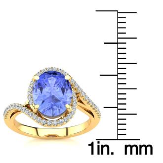 2 3/4 Carat Oval Shape Tanzanite and Halo Diamond Ring In 14 Karat Yellow Gold