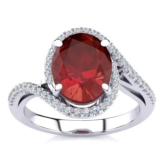 3 1/3 Carat Oval Shape Ruby and Halo Diamond Ring In 14 Karat White Gold