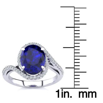 3 1/3 Carat Oval Shape Sapphire and Halo Diamond Ring In 14 Karat White Gold