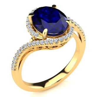 3 1/3 Carat Oval Shape Sapphire and Halo Diamond Ring In 14 Karat Yellow Gold