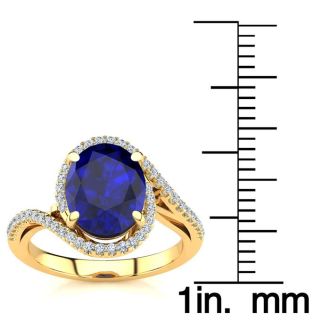 3 1/3 Carat Oval Shape Sapphire and Halo Diamond Ring In 14 Karat Yellow Gold