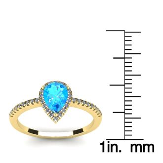 1 Carat Pear Shape Blue Topaz and Halo Diamond Ring In 14 Karat Yellow Gold