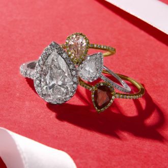1 Carat Pear Shape Ruby and Halo Diamond Ring In 14 Karat Yellow Gold
