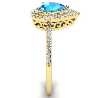 1 1/5 Carat Pear Shape Blue Topaz and Double Halo Diamond Ring In 14 Karat Yellow Gold