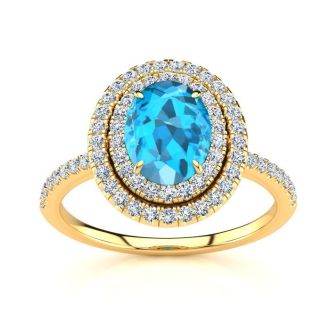 1 3/4 Carat Oval Shape Blue Topaz and Double Halo Diamond Ring In 14 Karat Yellow Gold
