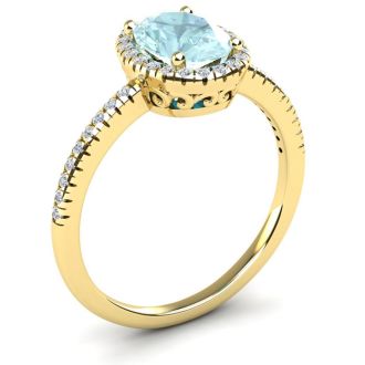 Aquamarine Ring: Aquamarine Jewelry: 1 1/3 Carat Oval Shape Aquamarine and Halo Diamond Ring In 14 Karat Yellow Gold