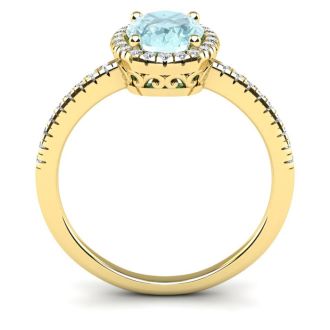 Aquamarine Ring: Aquamarine Jewelry: 1 1/3 Carat Oval Shape Aquamarine and Halo Diamond Ring In 14 Karat Yellow Gold