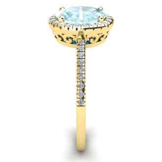 Aquamarine Ring: Aquamarine Jewelry: 1 1/3 Carat Oval Shape Aquamarine and Halo Diamond Ring In 14 Karat Yellow Gold