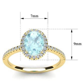 Aquamarine Ring: Aquamarine Jewelry: 1 1/3 Carat Oval Shape Aquamarine and Halo Diamond Ring In 14 Karat Yellow Gold
