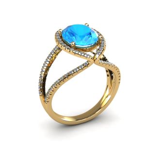 3 3/4 Carat Oval Shape Blue Topaz and Halo Diamond Ring In 14 Karat Yellow Gold