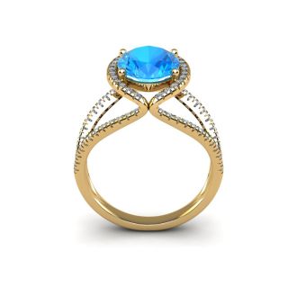 3 3/4 Carat Oval Shape Blue Topaz and Halo Diamond Ring In 14 Karat Yellow Gold