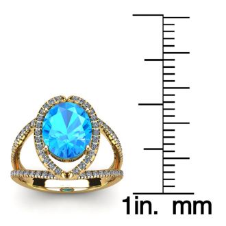 3 3/4 Carat Oval Shape Blue Topaz and Halo Diamond Ring In 14 Karat Yellow Gold