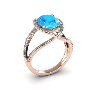 3 3/4 Carat Oval Shape Blue Topaz and Halo Diamond Ring In 14 Karat Rose Gold