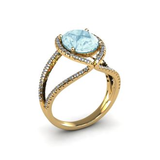 Aquamarine Ring: Aquamarine Jewelry: 2 3/4 Carat Oval Shape Aquamarine and Halo Diamond Ring In 14 Karat Yellow Gold