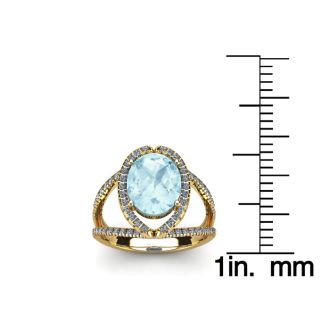 Aquamarine Ring: Aquamarine Jewelry: 2 3/4 Carat Oval Shape Aquamarine and Halo Diamond Ring In 14 Karat Yellow Gold