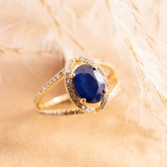 3 1/2 Carat Oval Shape Sapphire and Halo Diamond Ring In 14 Karat Yellow Gold