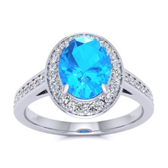 1 3/4 Carat Oval Shape Blue Topaz and Halo Diamond Ring In 14 Karat White Gold