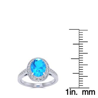 1 3/4 Carat Oval Shape Blue Topaz and Halo Diamond Ring In 14 Karat White Gold