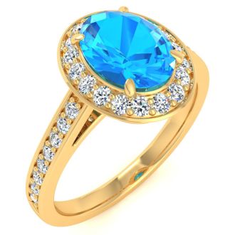 1 3/4 Carat Oval Shape Blue Topaz and Halo Diamond Ring In 14 Karat Yellow Gold